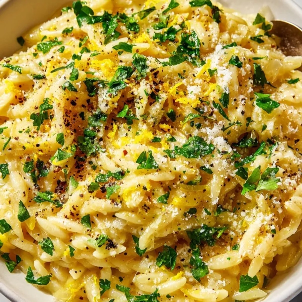 Creamy Orzo Risotto Style with Parmesan, shimmering with zest, served warm for dinner.