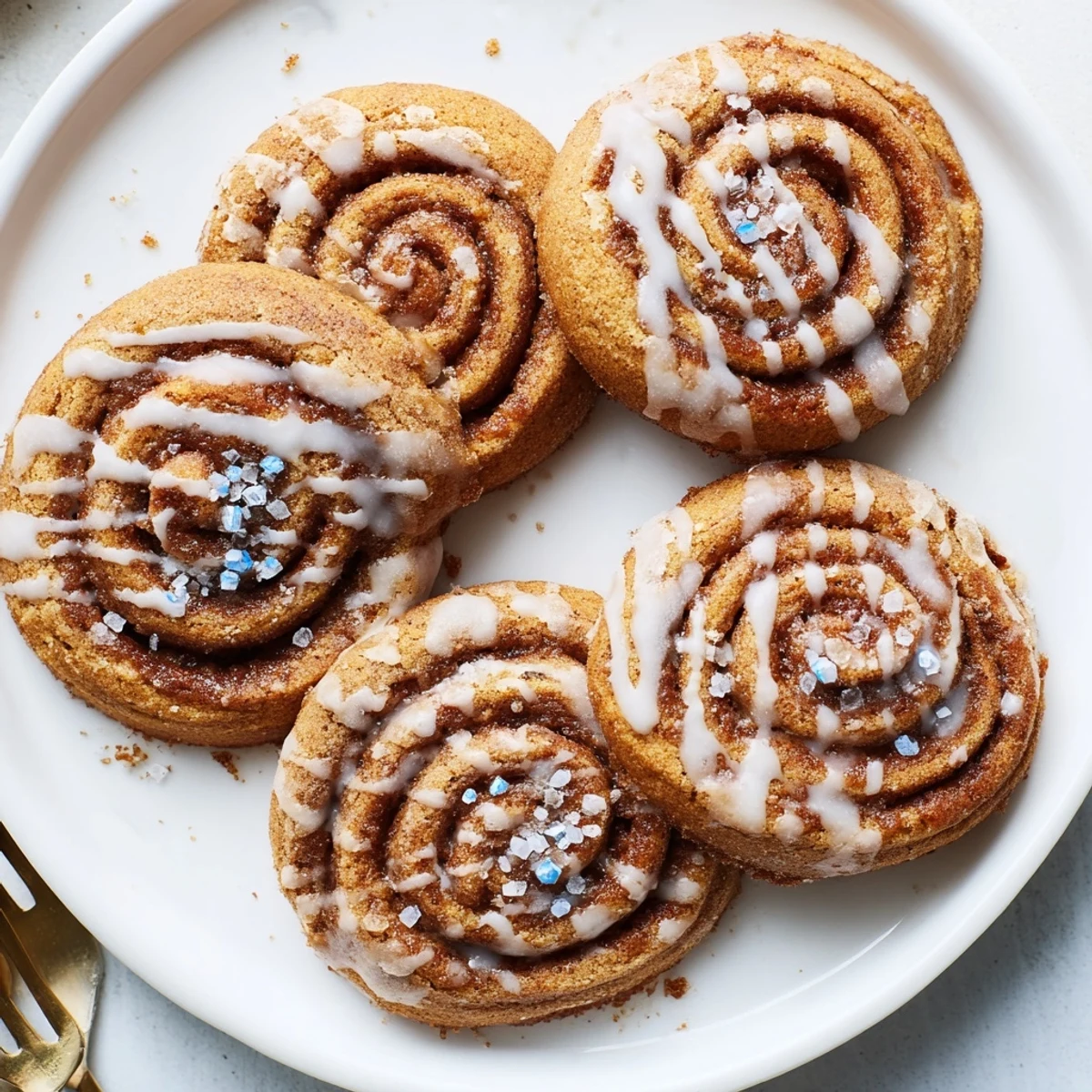 Soft Gingerbread Hanukkah cinnamon roll cookies drizzled with sweet vanilla glaze.