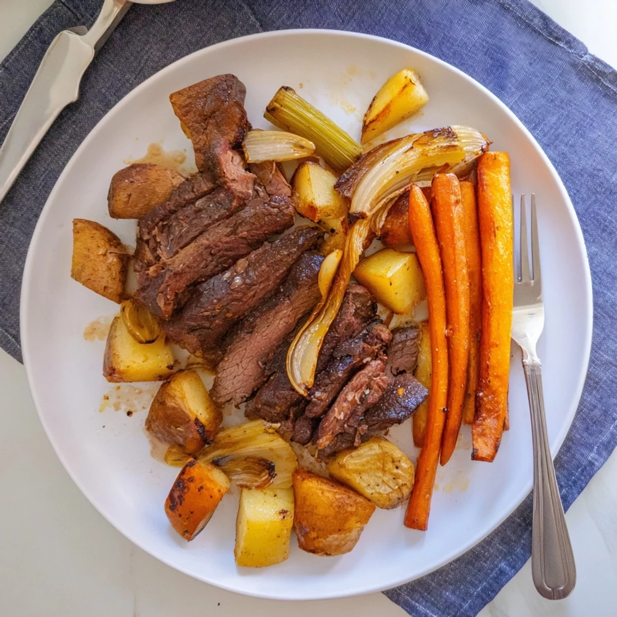 Tender Sunday pot roast simmered with savory roasted veggies for a comforting meal.  