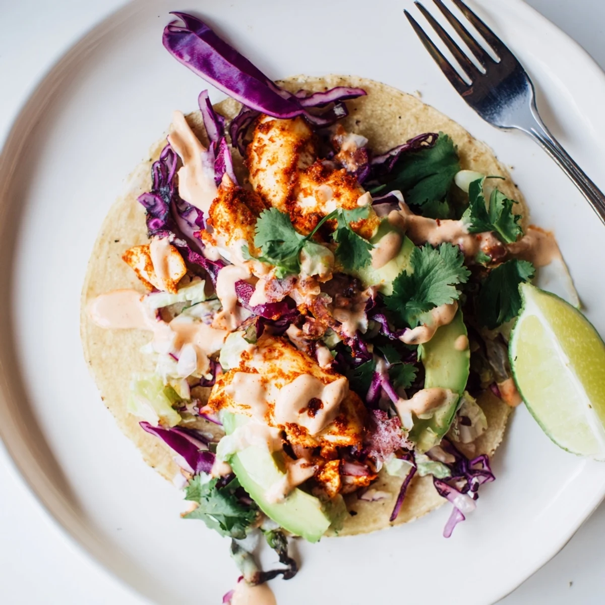 Tender chipotle lime roasted fish tacos with fresh toppings in warm tortillas.  