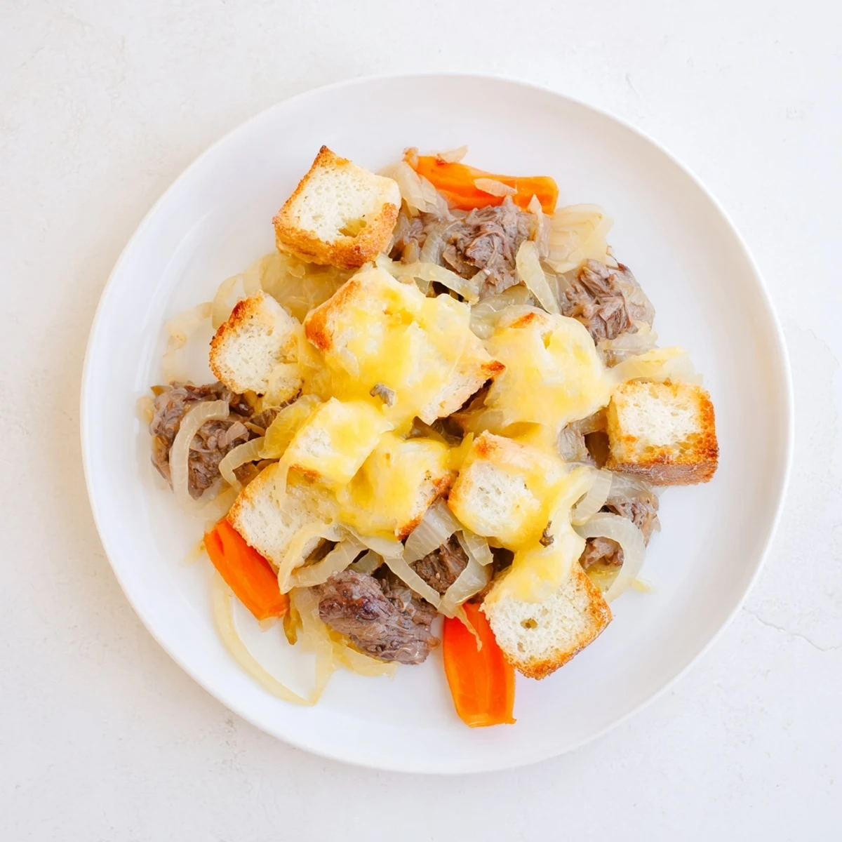 Hearty French Onion Pot Roast Casserole, a comforting blend of beef, onions, and cheesy goodness.