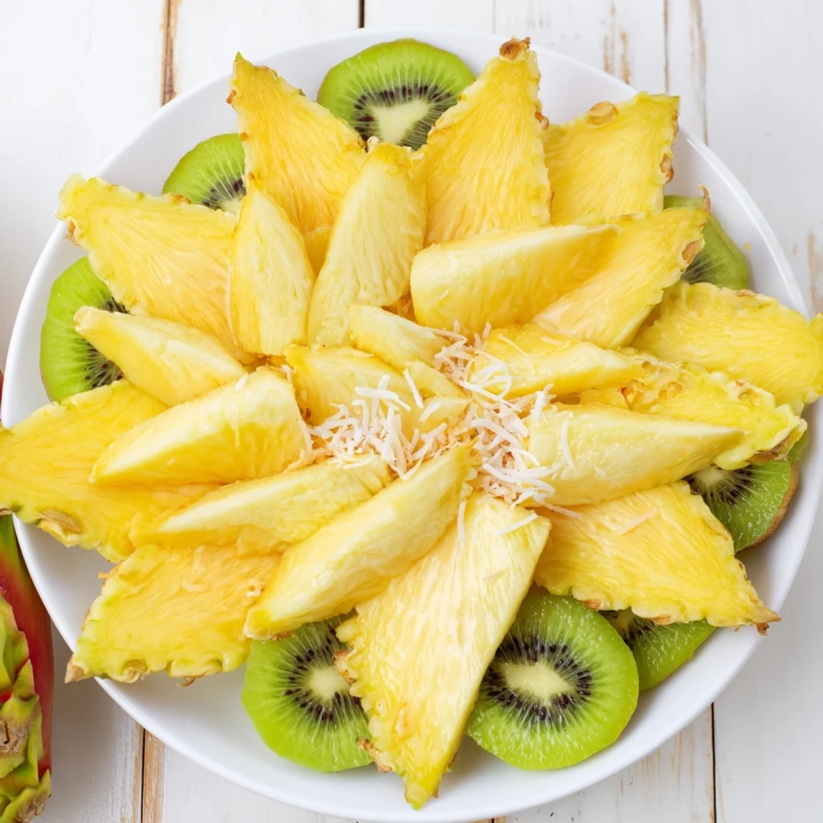 This eye-catching pineapple sun fruit platter bursts with sweet, ripe mangoes and kiwi, perfect for a summer BBQ.