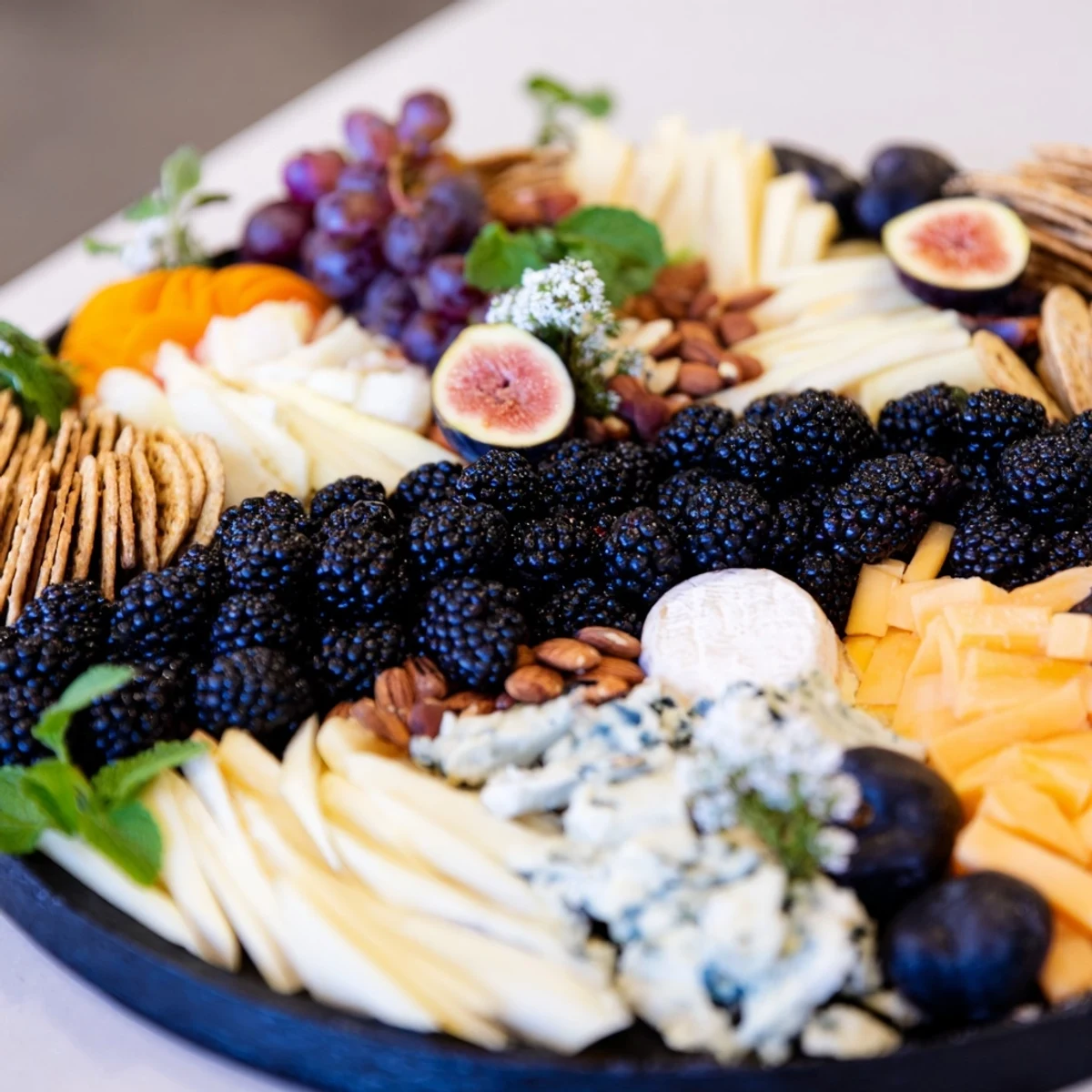 A visually stunning Yin-Yang Balance appetizer board overflowing with fresh fruits, cheeses, and crackers.
