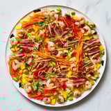 Beautifully arranged Lunar New Year Dragon Platter, showcasing fresh Asian flavors perfect for sharing.