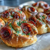 Appetizing Hot Honey Pepperoni Pizza Rolls, baked to perfection with gooey filling.
