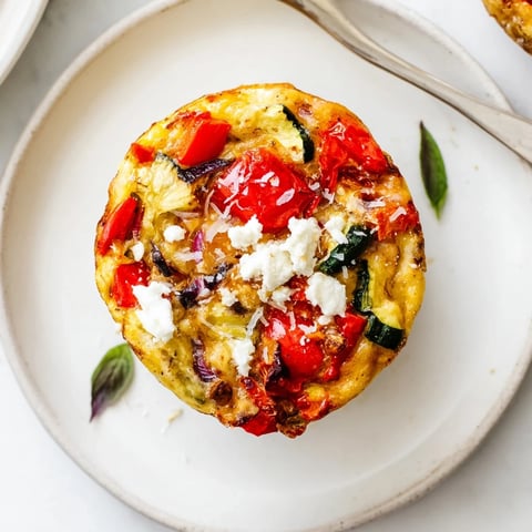 Mini Roasted Veg & Goat Cheese Frittata Muffins served warm, perfect for any brunch gathering.  