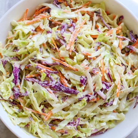 Vibrant green and red cabbage with carrots in a creamy dressing, perfect for a Coleslaw With Creamy Dressing side dish.