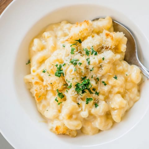Close-up of creamy Mac and Cheese Sourdough Skillet, a crispy, rustic comfort food.