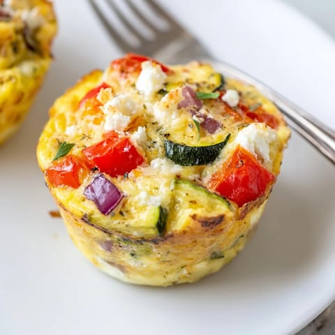 Delicious Roasted Veg & Goat Cheese Frittata Muffins, bursting with flavor and nutrition.  