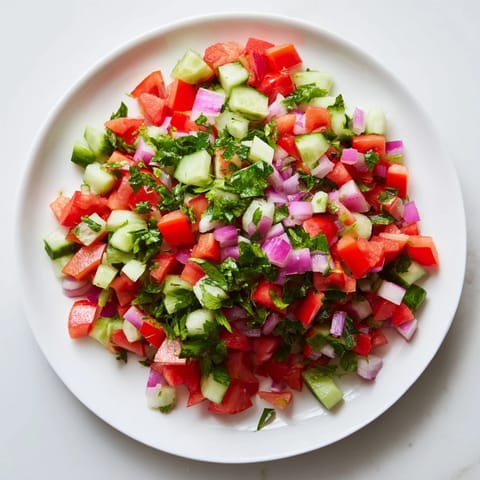 Close-up of bright green Pickle De Gallo Salsa, perfect with tortilla chips and a squeeze of lime.
