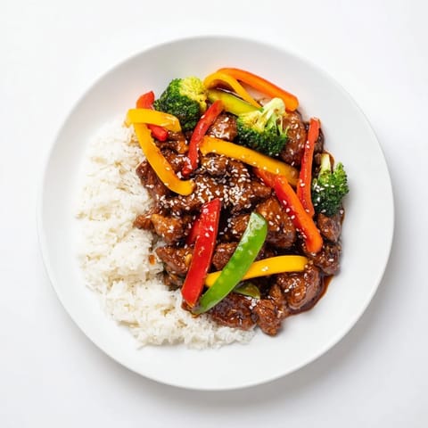 This homemade Chicken Stir-Fry with Vegetables and Rice features tender chicken and a flavorful stir-fry sauce.
