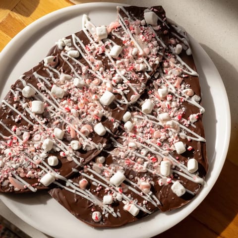 Homemade Hot Chocolate Bomb Bark, featuring a crackly chocolate layer loaded with marshmallows and cocoa mix.