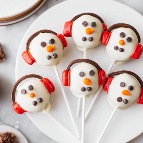 Enjoy festive Budget-Friendly Oreo Snowman Pops, a delightful no-bake treat ready in minutes.