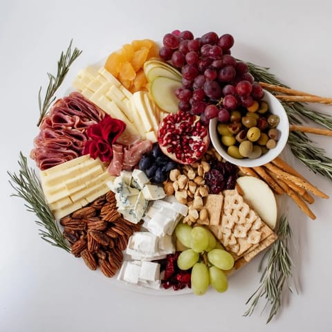This visually stunning Winter Wonderland Grazing Tray features creamy cheeses, savory charcuterie, and sweet treats ready to enjoy.