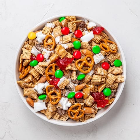 Enjoy the delicious blend of sweet, salty Holiday Mix, a perfect holiday snack mix recipe.