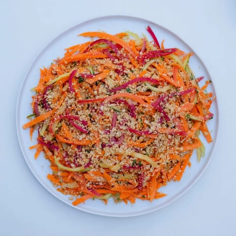 Crunchy cucumbers and carrots tossed in tangy peanut dressing create this refreshing Thai-Style Peanut Cucumber Salad.