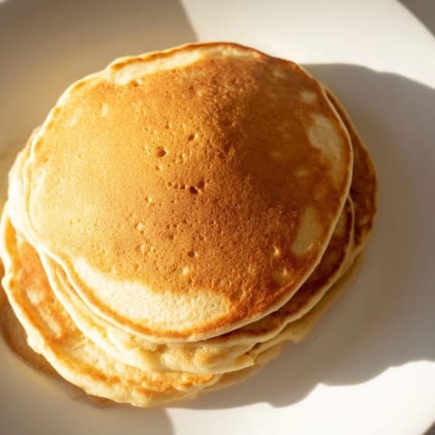 Quick and easy brown banana pancakes, perfectly browned and ready for a breakfast treat.