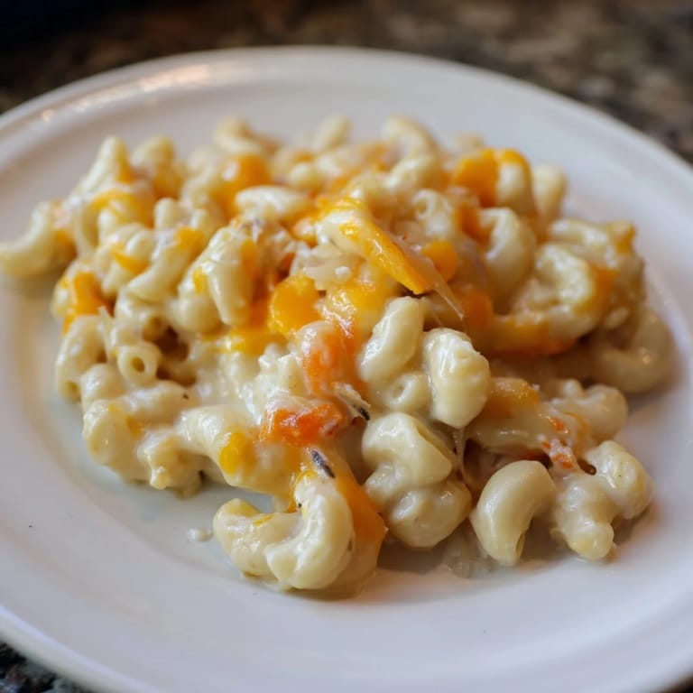 Hearty One-Pot Butternut Squash Mac & Cheese, with tender pasta, vibrant orange squash, ready to eat.