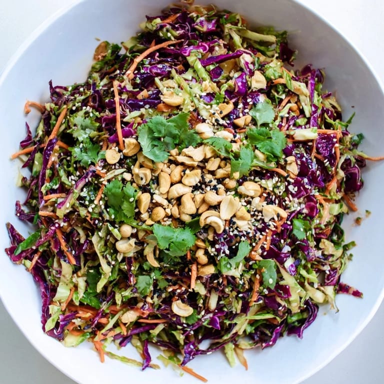 Tangy sesame dressing coats every shred in this Asian Cabbage Salad, perfect for pairing with grilled chicken or enjoying as a light vegan meal.
