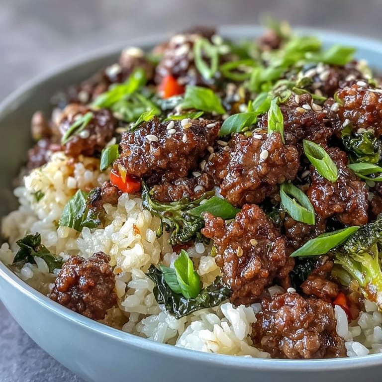 Colorful beef and veggie meal prep bowls served over fluffy rice, perfect for busy weekdays.  